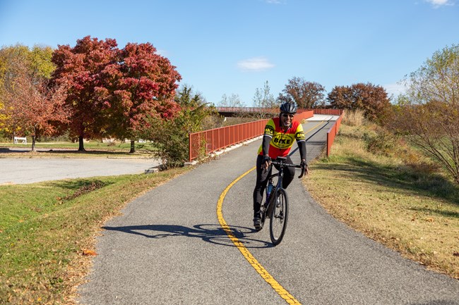 A biker coming down the Anacostia River Trail